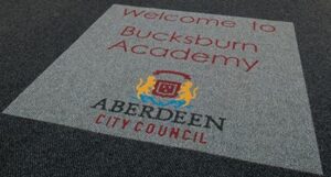 Custom flooring example of the inset Bespoke logo mat