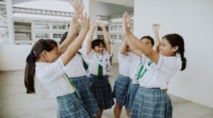 School girls cheering in unity