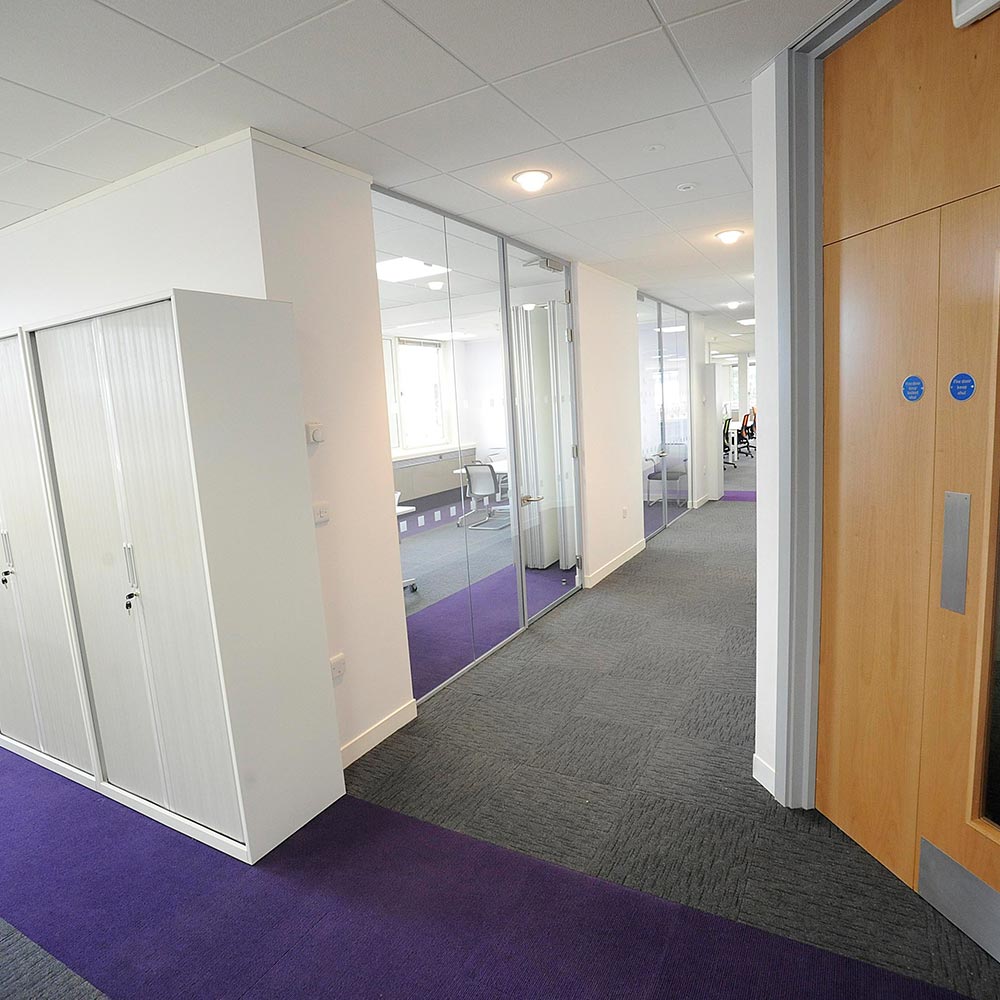 Heckmondwike Array Black and Broadrib Purple Carpet Tiles in Office