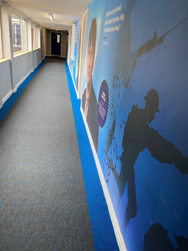 Blue Broadrib borders and Array tiles have been installed in the school's corridors to match the wall designs