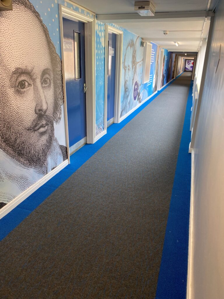Blue Broadrib borders and Array tiles have been installed in the school's corridors to match the wall designs