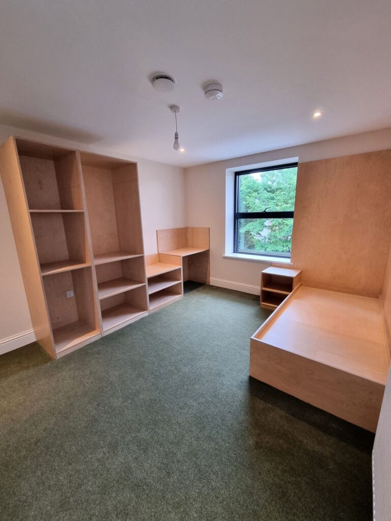 Supacord in Pale Olive installed in the bedrooms with new wooden furniture