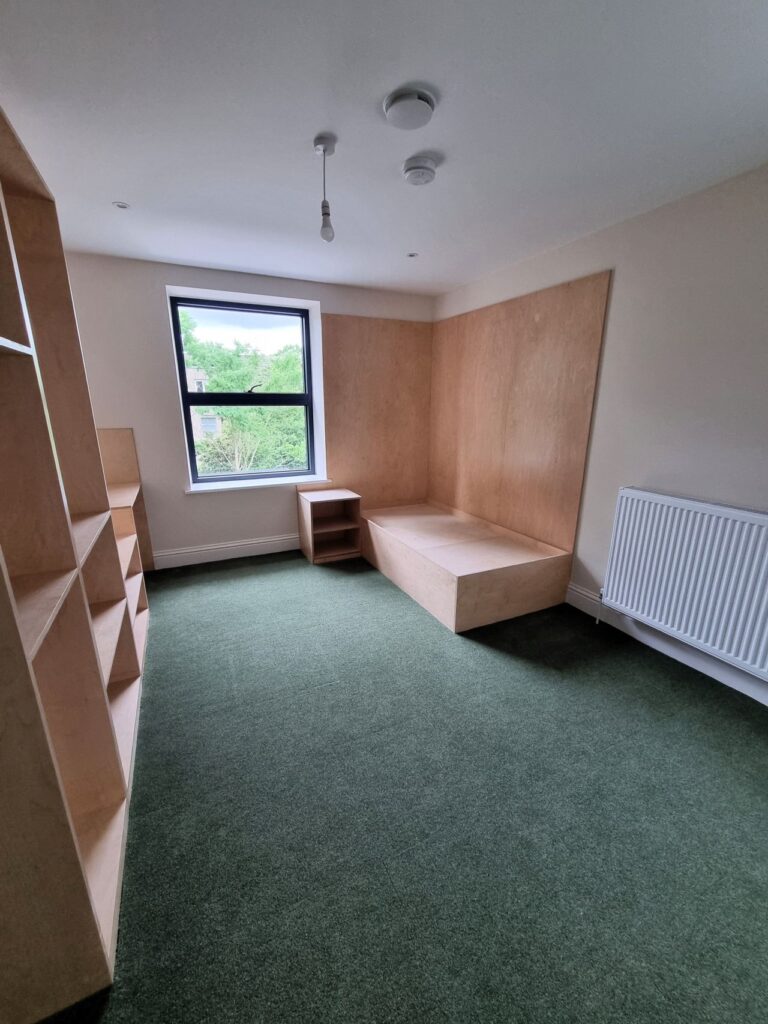 Supacord in Pale Olive installed in the bedrooms with new wooden furniture